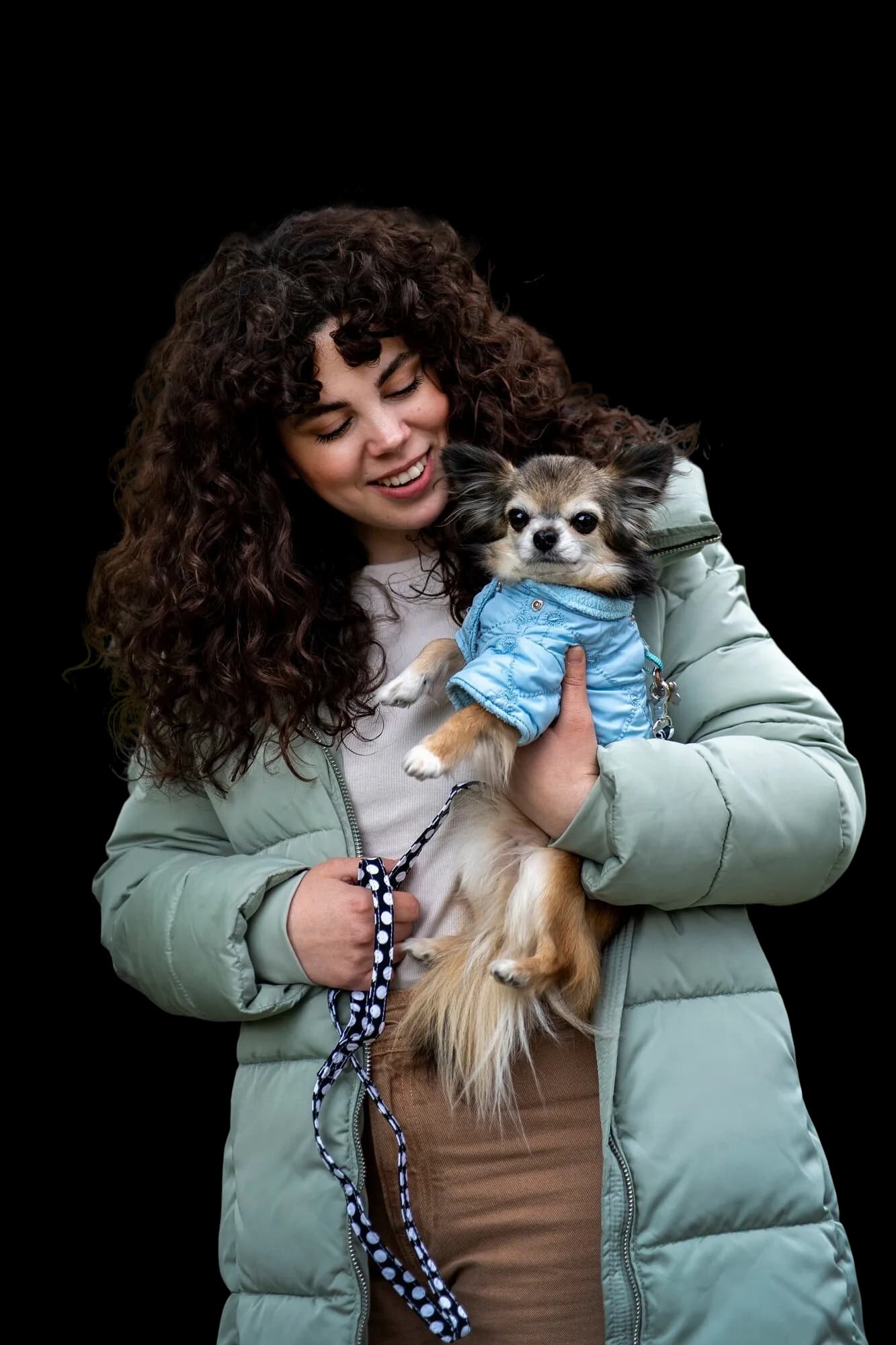 Woman holding her dog